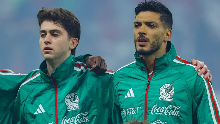 Brian Gutierrez and Raul Jimenez sing the National Anthem during the international friendly match