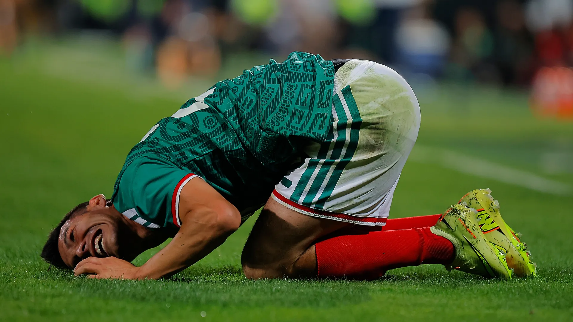 Hirving Lozano of Mexico lies on the ground after being inured during an international friendly. Manuel Guadarrama/Getty Images