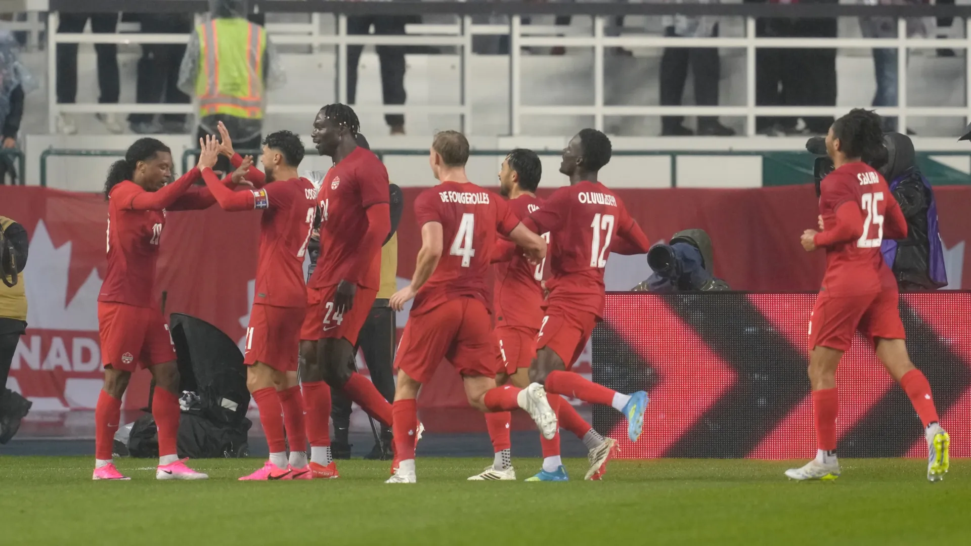 Jayden Nelson of Canada celebrates with teammates after scoring his team’s first goal. Jeff Vinnick/Getty Images