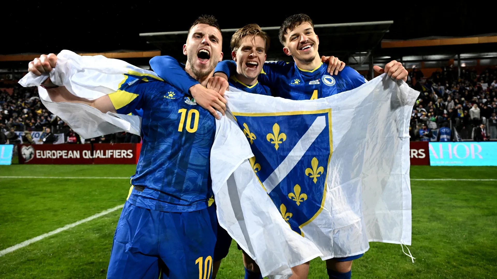 (L-R) Ermedin Demirovic, Dzenis Burnic and Tarik Muharemovic of Bosnia & Herzegovina celebrate the victory. Getty Images