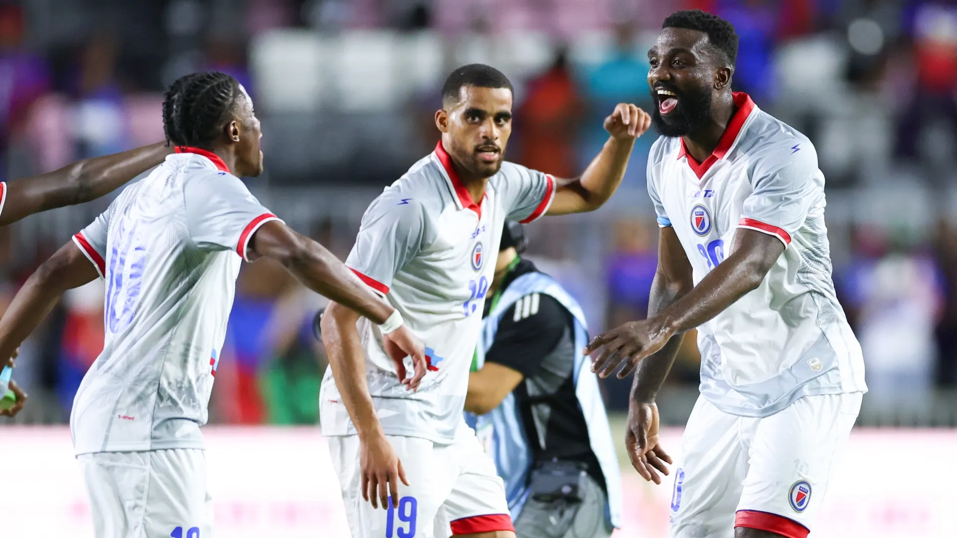 Haiti players with White uniforms.