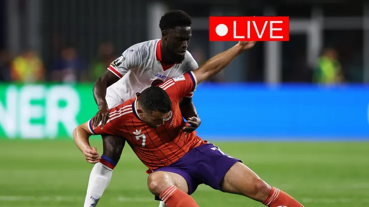 John McGinn #7 of Scotland is challenged by Carlens Arcus #2 of Haiti