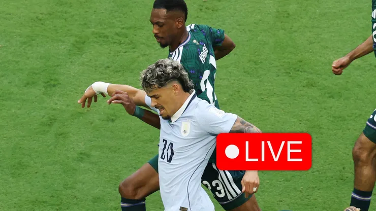 Maxi Araujo #20 of Uruguay controls the ball against Mohamed Kanno.
