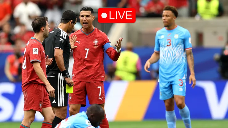 Cristiano Ronaldo #7 of Portugal argues with referee Abdulrahman Al Jassim.