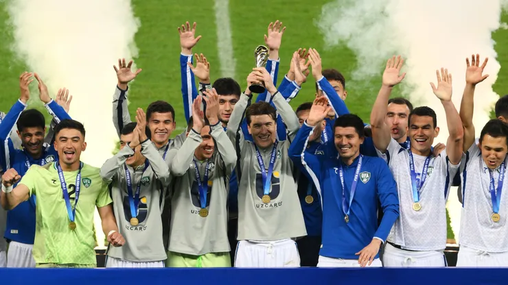 Eldor Shomurodov of Uzbekistan lifts the FIFA Series 2026 trophy.
