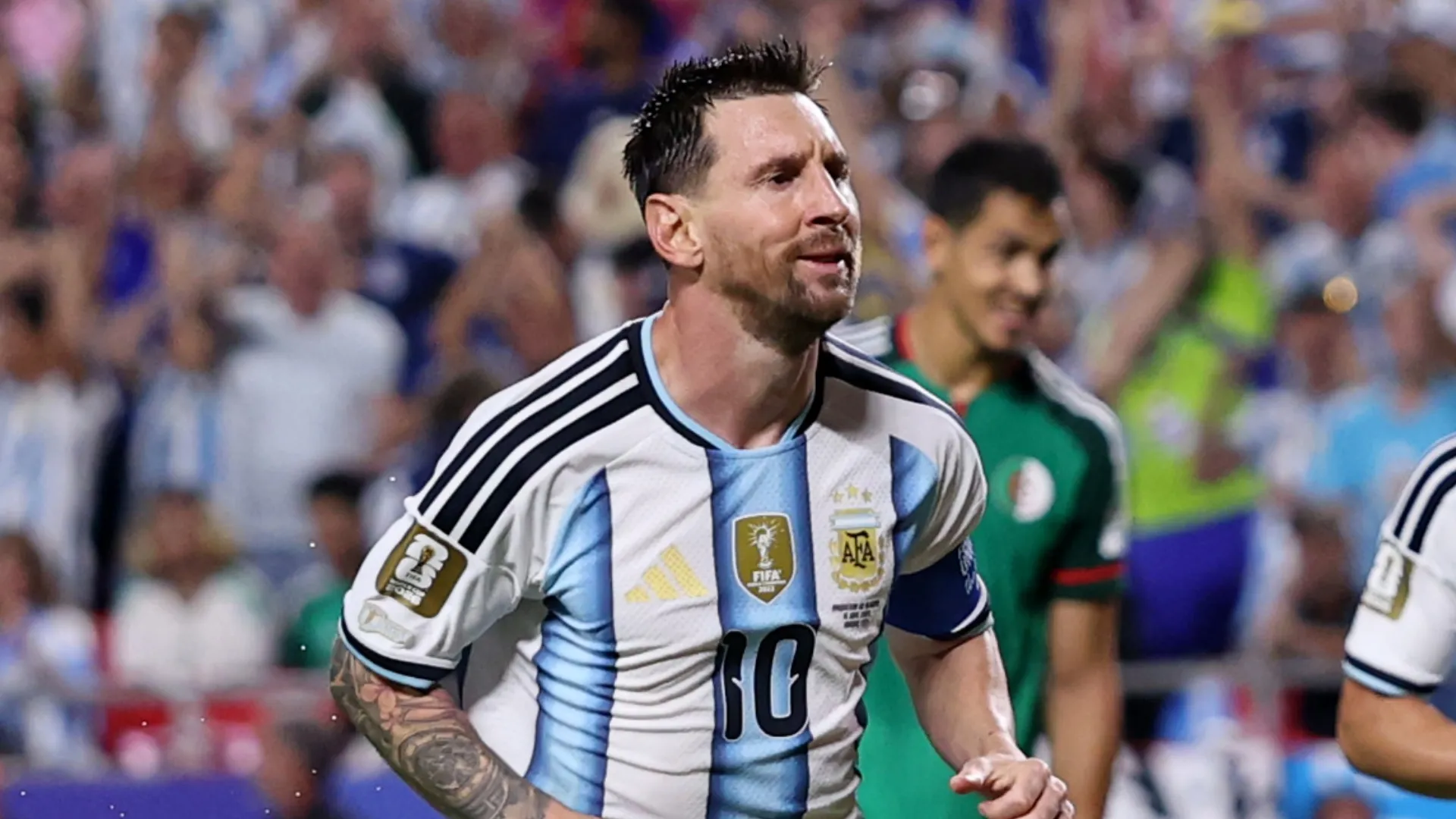 Lionel Messi looks on