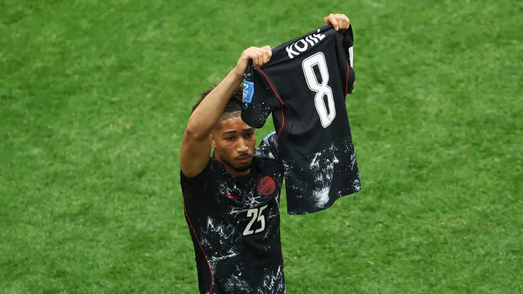 Nathan Saliba shows Ismael Kone's jersey in celebration.