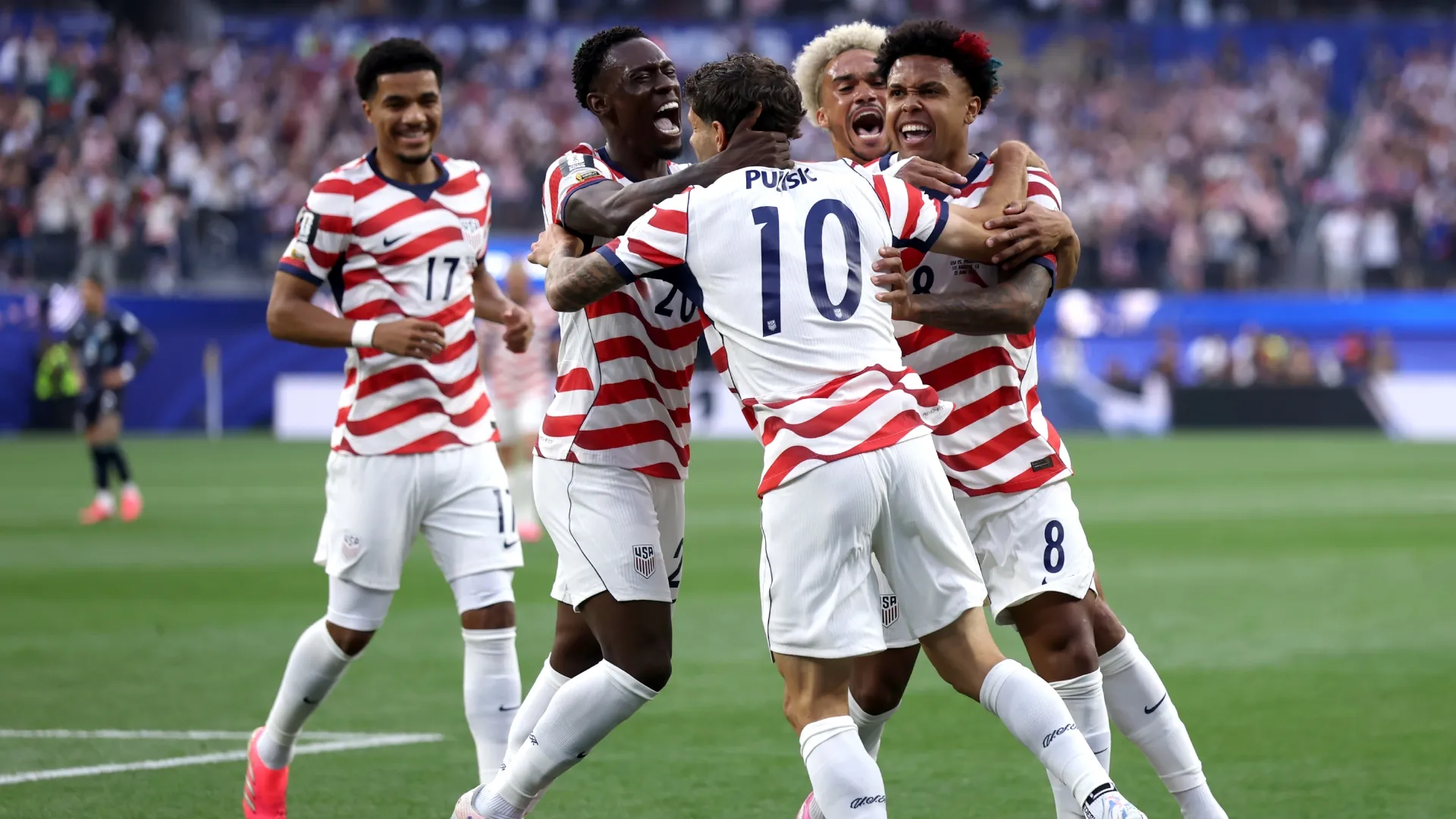 Christian Pulisic #10 and Weston McKennie #8 of the United States celebrate their side’s first goal. Dean Mouhtaropoulos/Getty Images