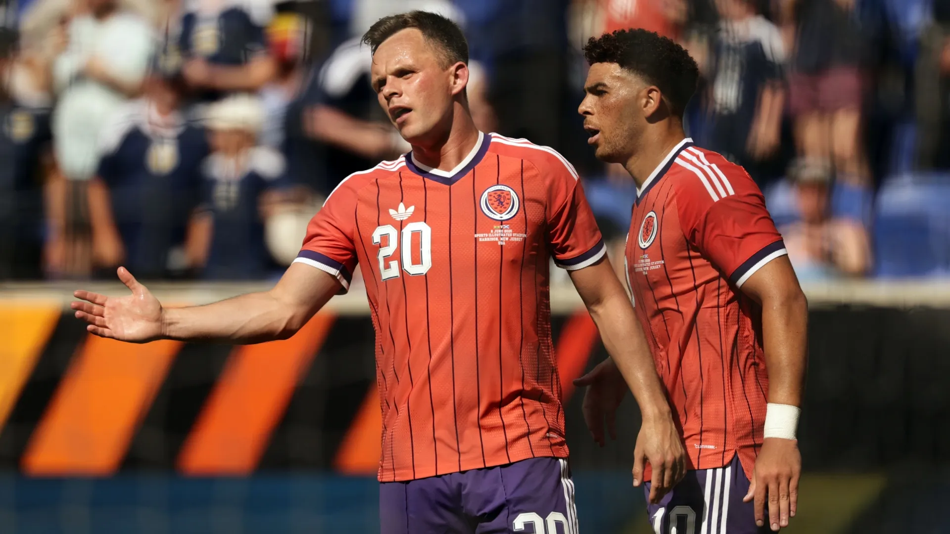 Lawrence Shankland #20 of Scotland reacts after forward Che Adams #10 of Scotland scored his first goal. Adam Hunger/Getty Images