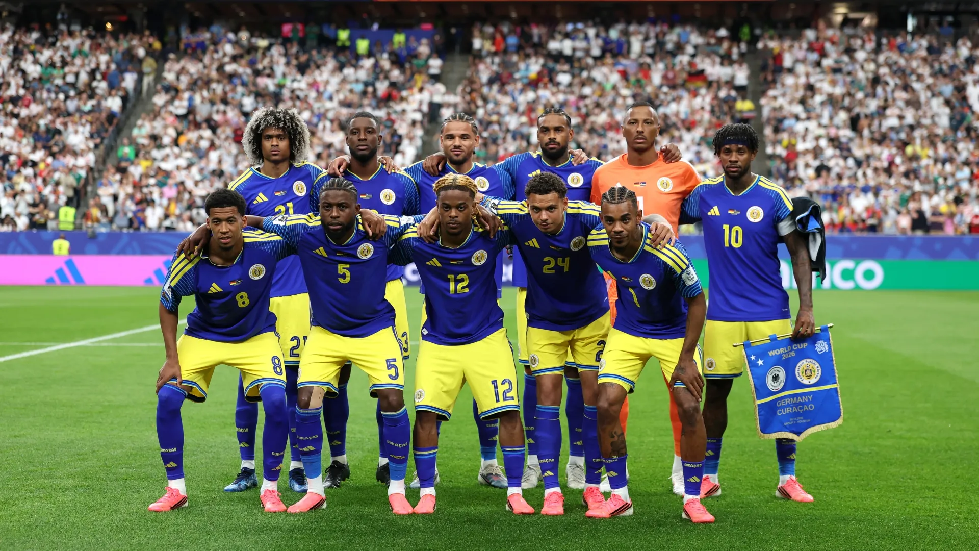 Curacao players pose for a team photo during the FIFA World Cup 2026 Group E match. Molly Darlington/Getty Images