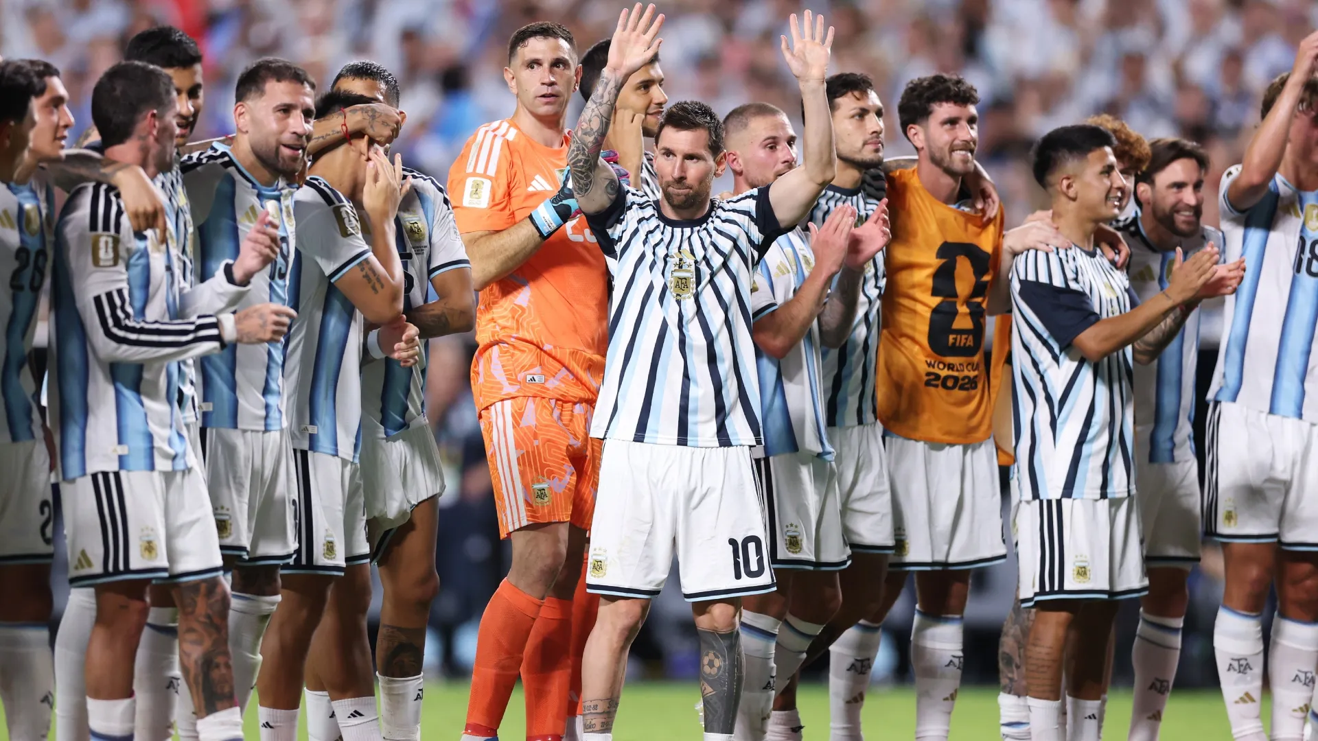 Lionel Messi #10 and players of Argentina line up to applaud fans. Michael Steele/Getty Images