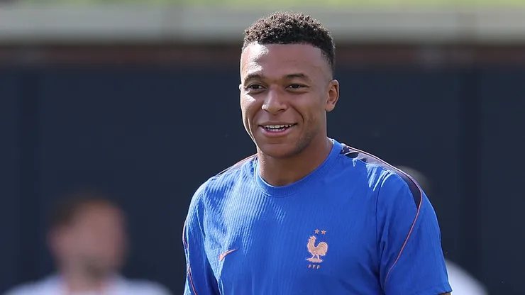 Kylian Mbappé #10 of France enjoys a laugh during the team's training.