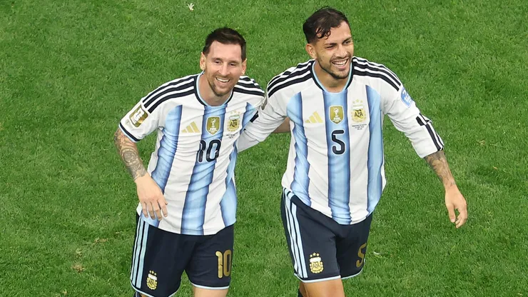 Lionel Messi #10 of Argentina celebrates with teammate Leandro Paredes #5.