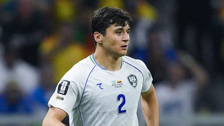 Abdukodir Khusanov #2 of Uzbekistan runs with the ball.
