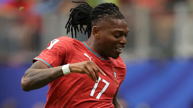 Rafael Leao #17 of Portugal is tackled by Aaron Wan-Bissaka #2 of Congo DR.