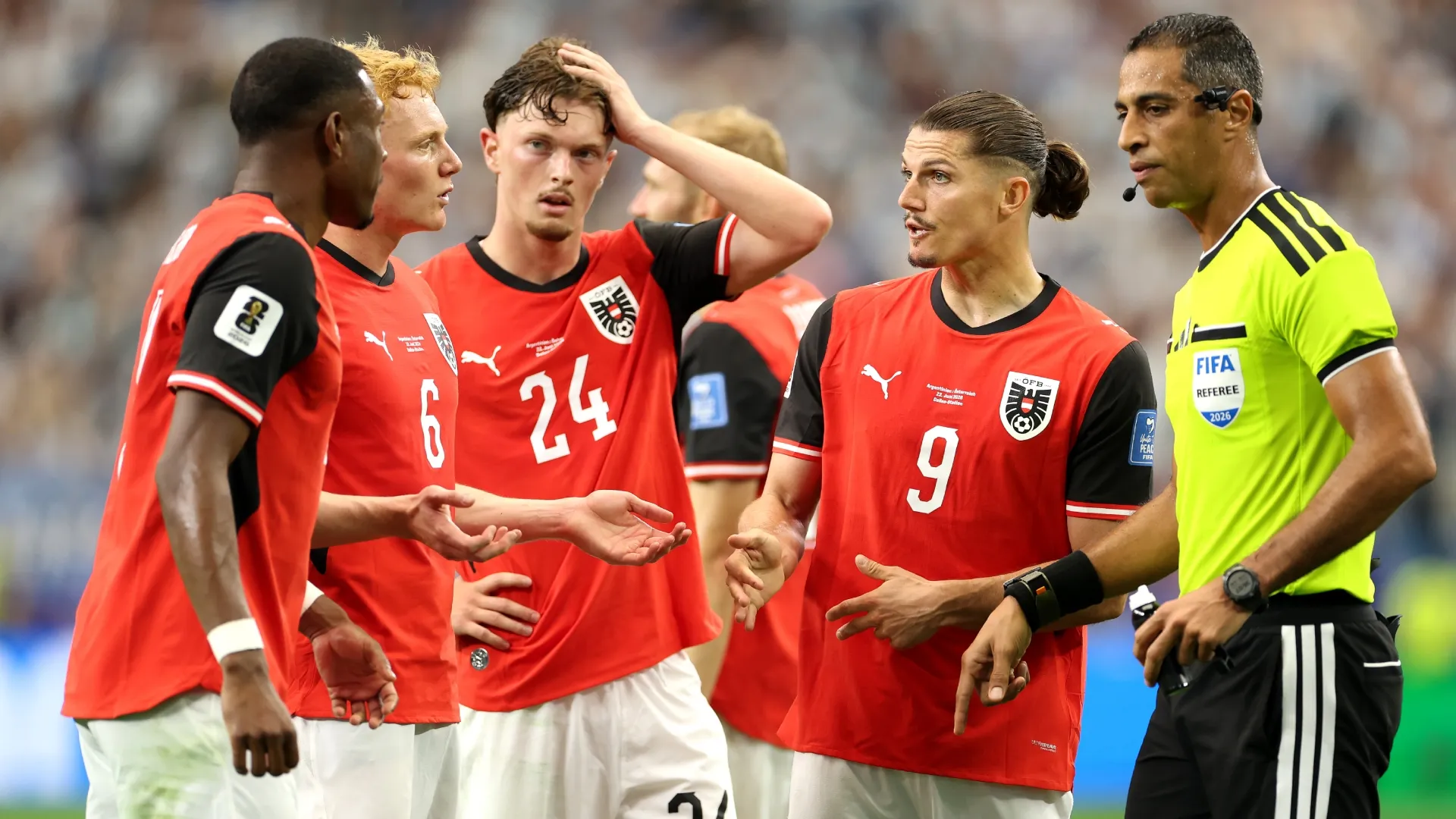 Players of Austria and Referee Amin Mohamed Omar