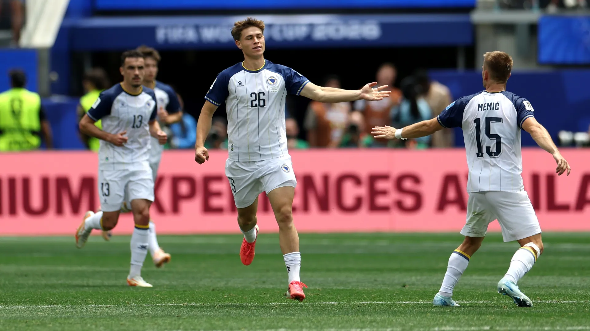 Ermin Mahmic #26 of Bosnia and Herzegovina celebrates with Amar Memic #15 after scoring the team’s first goal. Harry How/Getty Images