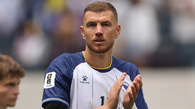 Bosnia and Herzegovina, striker Edin Dzeko applauds the fans.