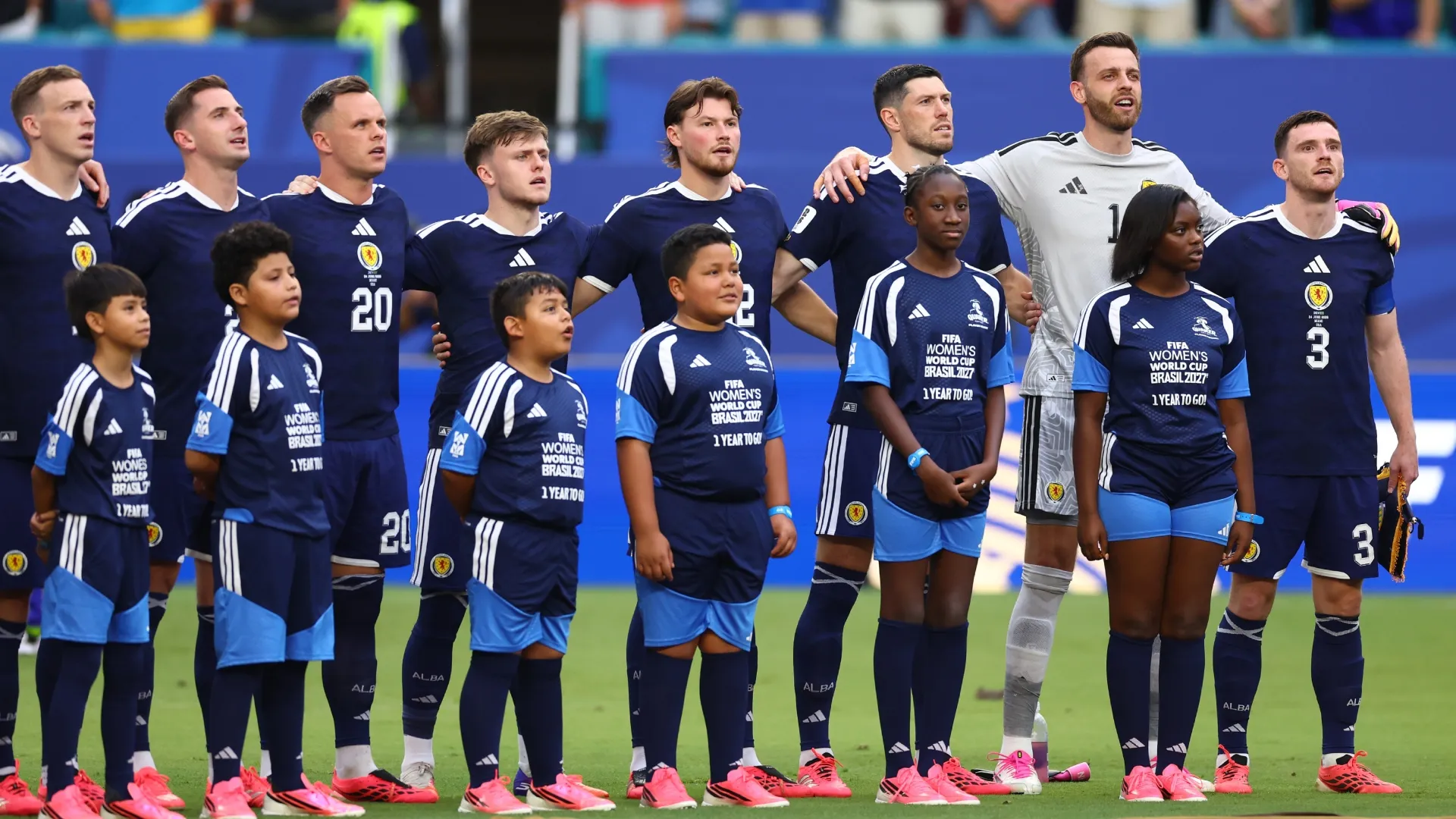 Andy Robertson #3 of Scotland and teammates stand for the national anthem. Megan Briggs/Getty Images