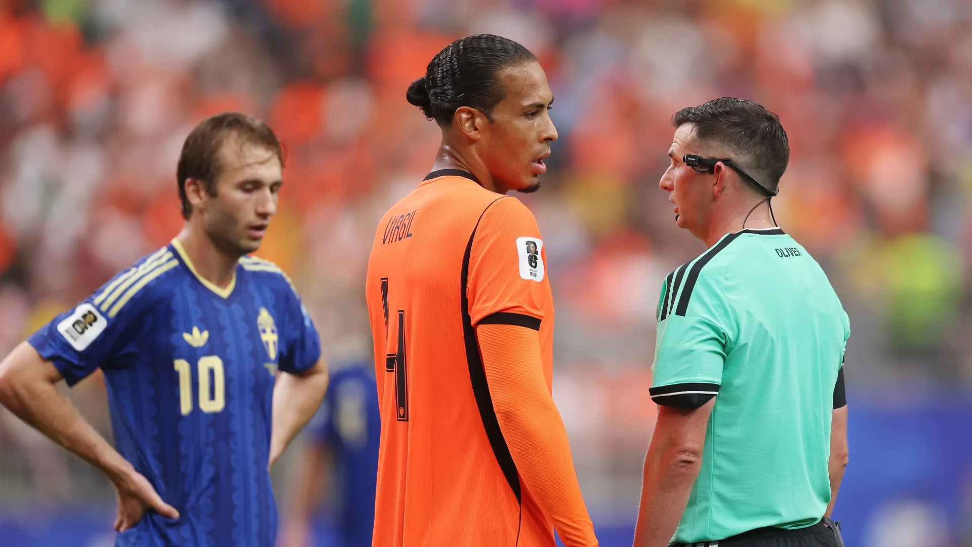 Michael Oliver with Sweden and Netherlands players