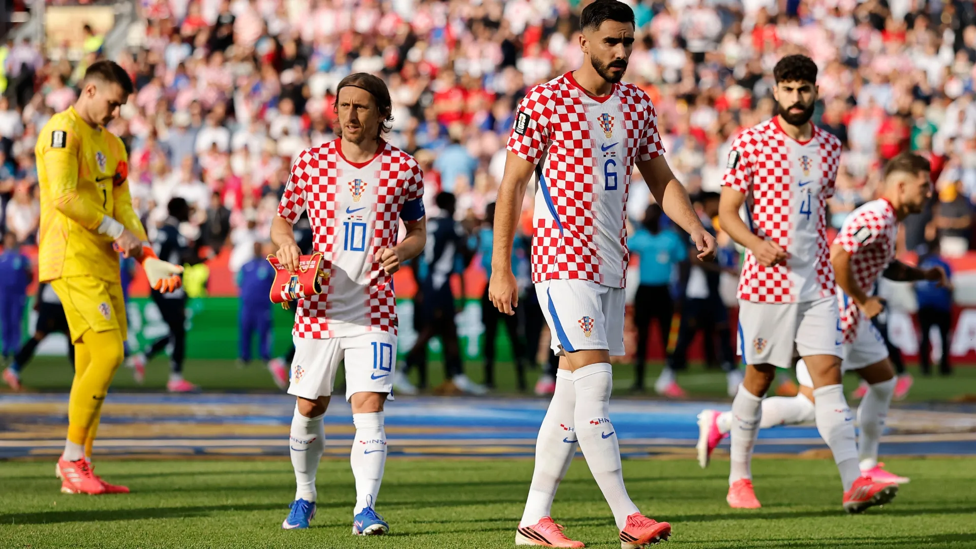 Dominik Livakovic #1, Luka Modric #10, Josip Sutalo #6 and Josko Gvardiol #4 of Croatia. Michael Reaves/Getty Images