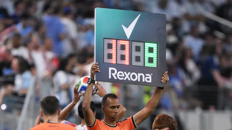 Fourth official with subtitution signal