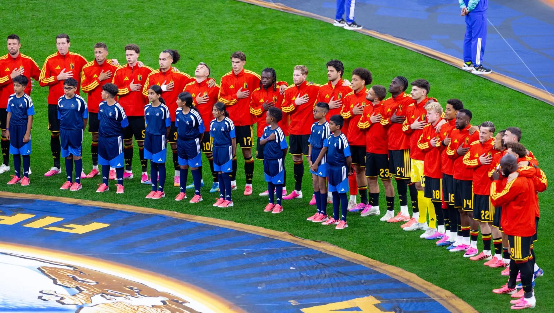 Players of Belgium stand for the national anthem. Fran Santiago/Getty Images