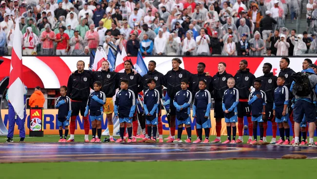 Harry Kane #9 of England and teammates stand for the national anthem. Mattia Ozbot/Getty Images