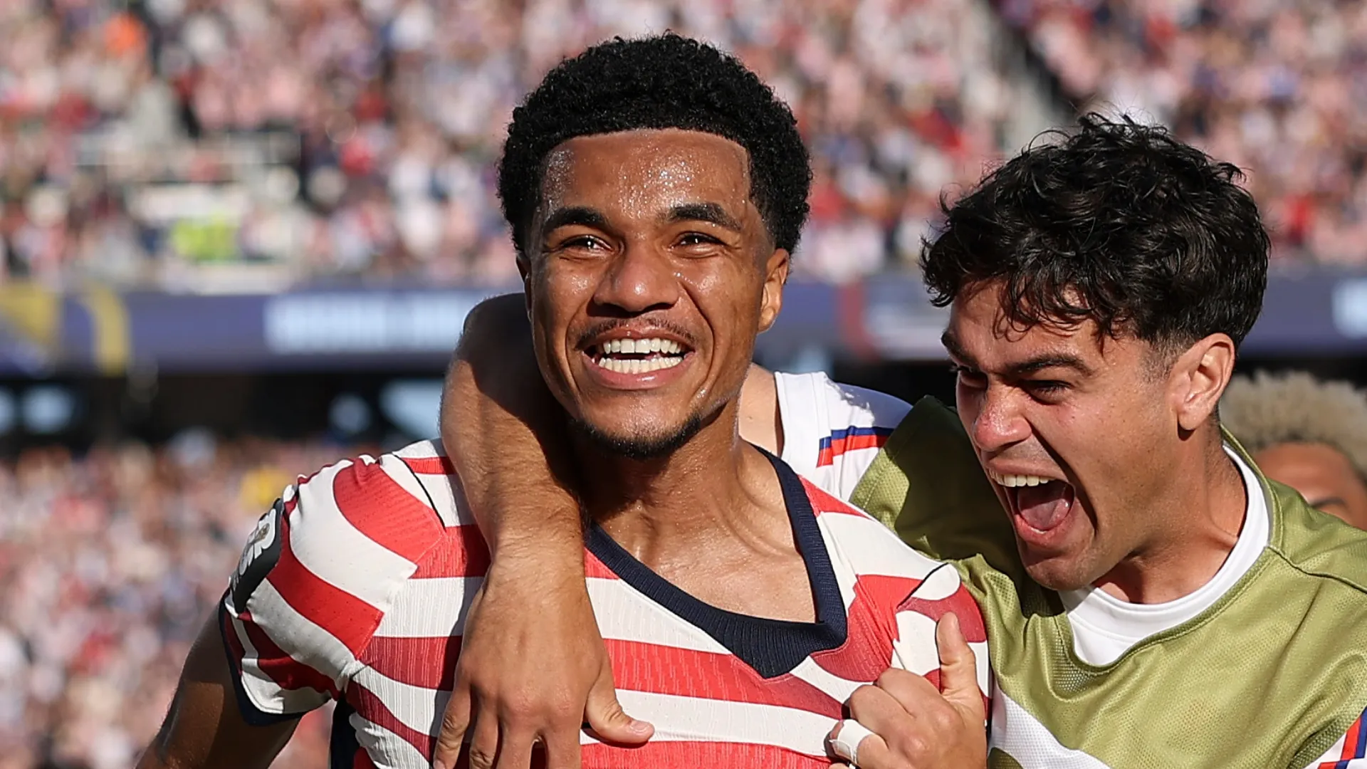 Malik Tillman celebrates his goal.
