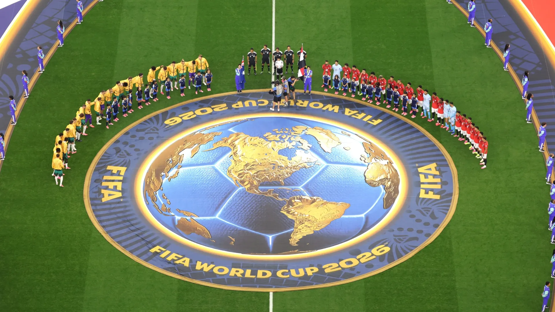 Players and match officials line up for the national anthem. Lars Baron/Getty Images