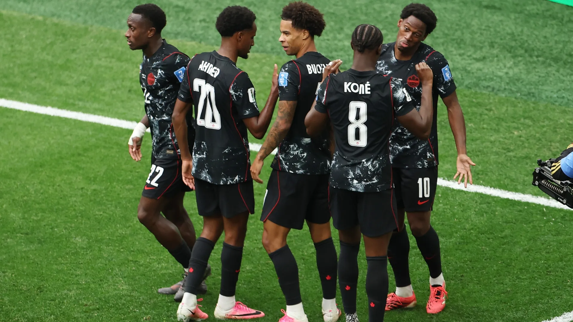 Jonathan David #10 of Canada celebrates with teammates after scoring his team’s second goal. Emilee Chinn/Getty Images