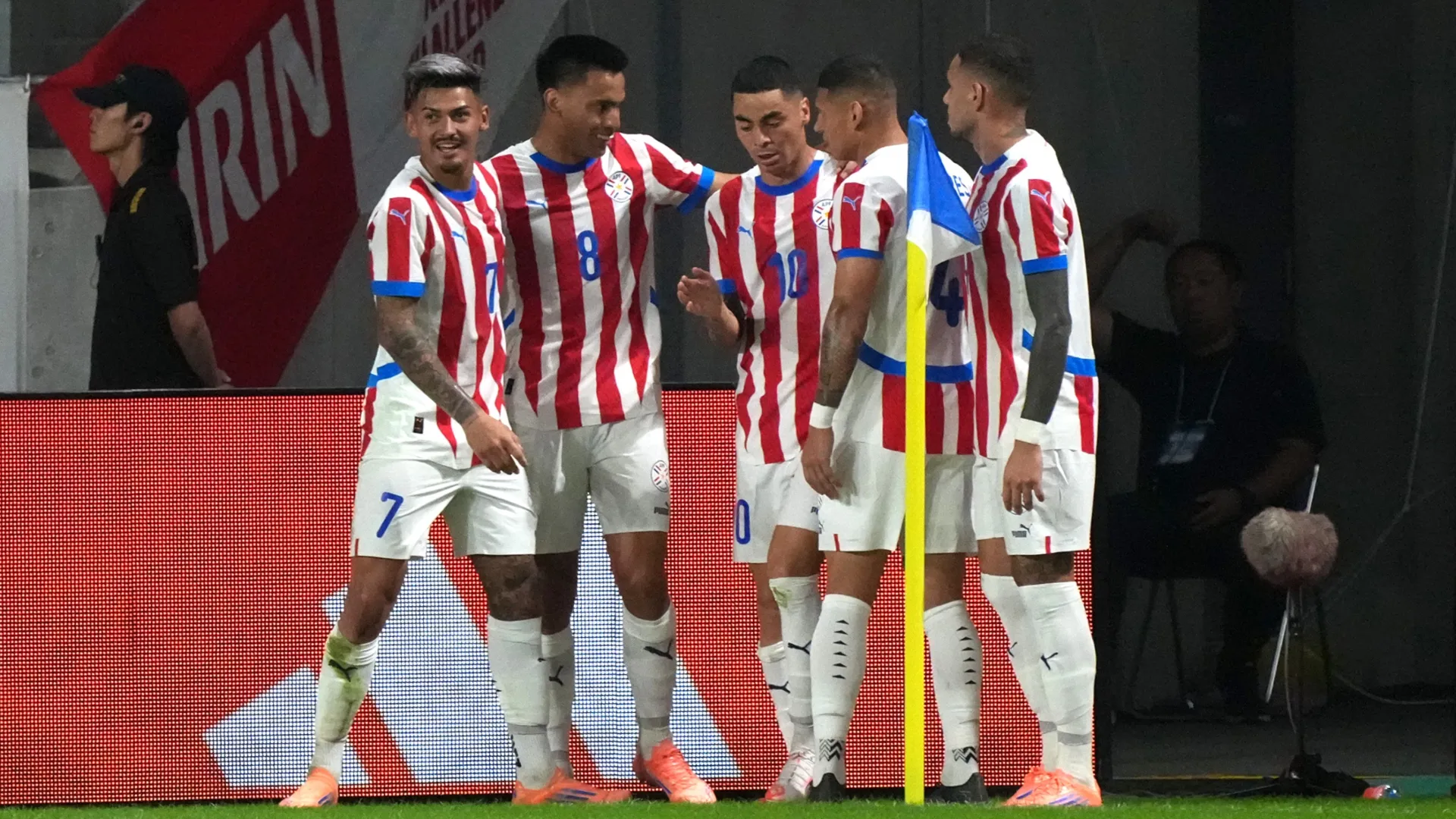 Miguel Almiron of Paraguay (C) celebrates with teammates. Koji Watanabe/Getty Images