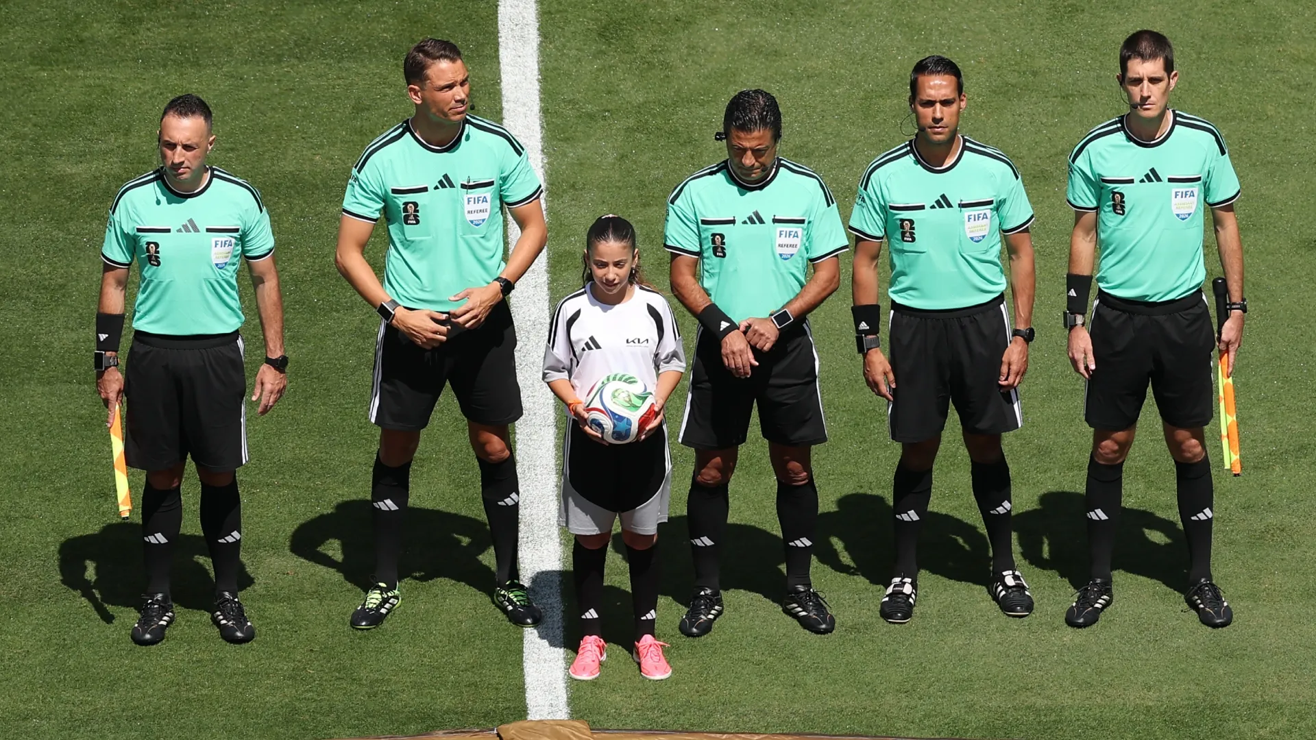 Referee Alireza Faghani (C)