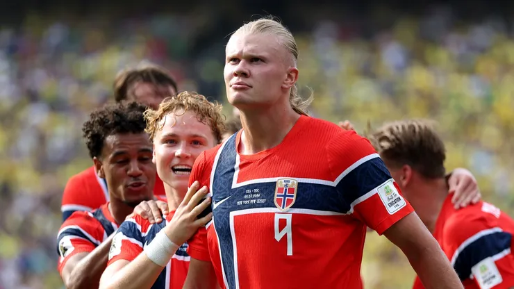 Erling Haaland #9 of Norway celebrates with teammates after scoring his team's first goal.