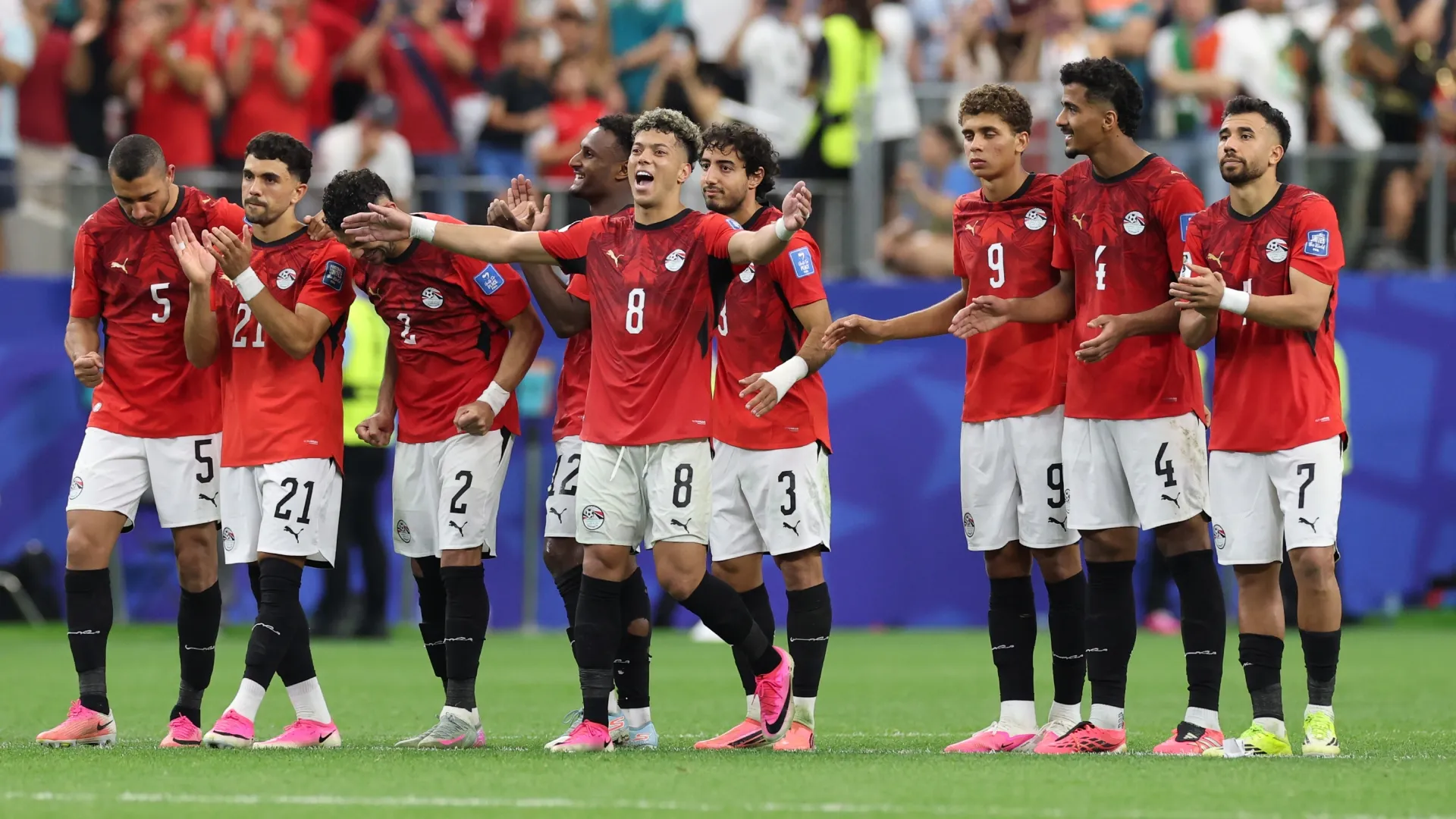 Egypt players celebrate after Mohamed Salah #10 scores the third penalty. Kevin C. Cox/Getty Images