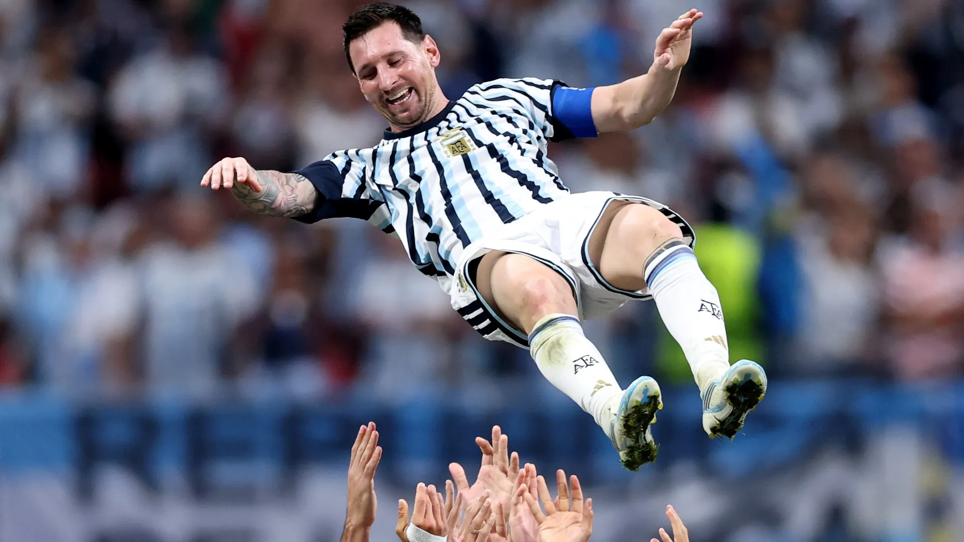Lionel Messi #10 of Argentina celebrates with teammates. Justin Setterfield/Getty Images