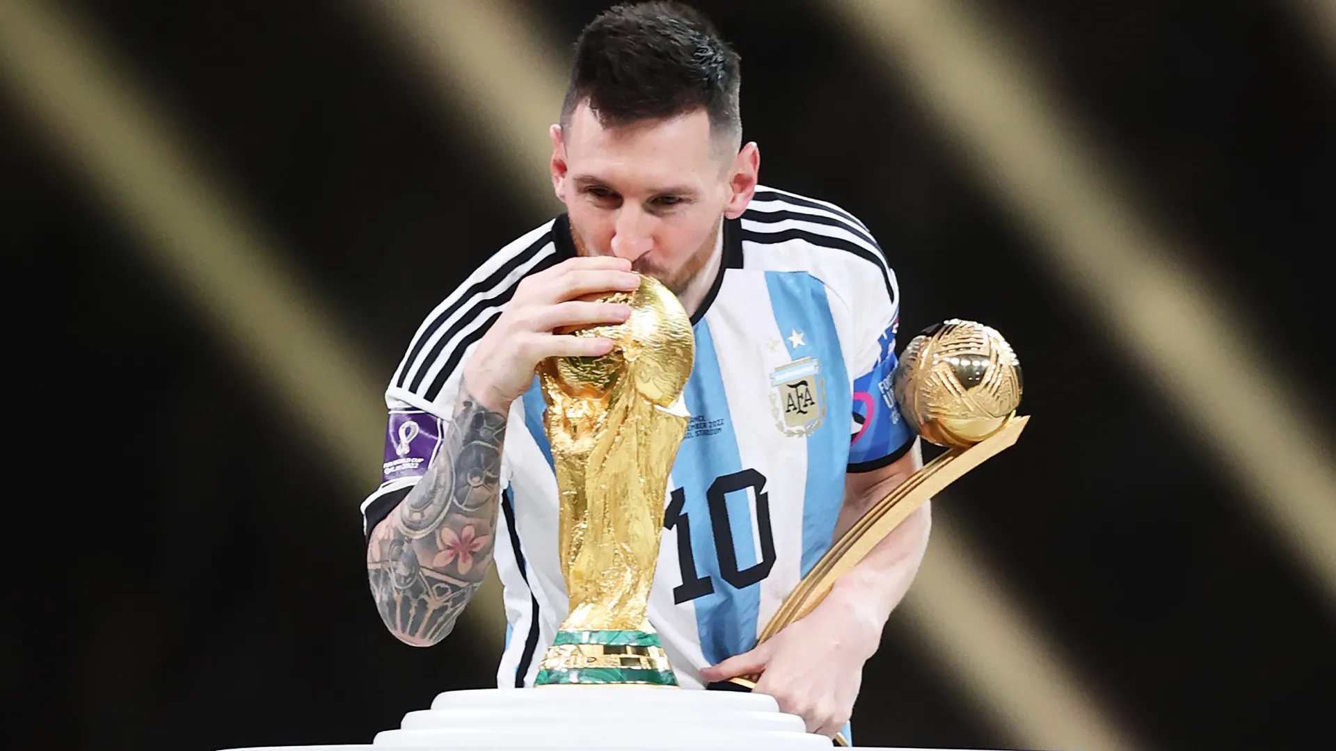 Lionel Messi of Argentina kisses the FIFA World Cup Qatar 2022 Winners’ Trophy (Source: Julian Finney/Getty Images)