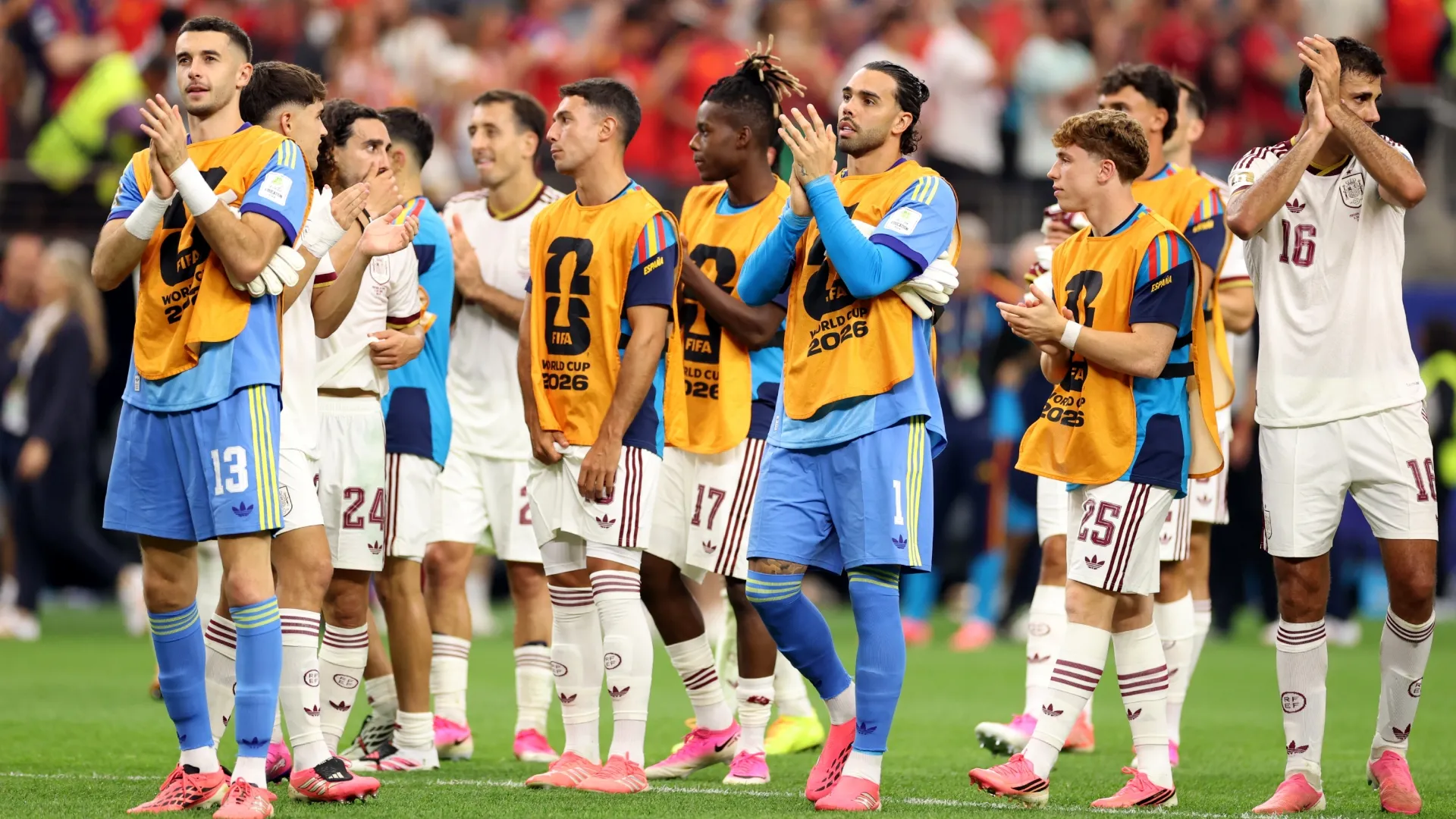 Players of Spain applaud fans. Florencia Tan Jun/Getty Images