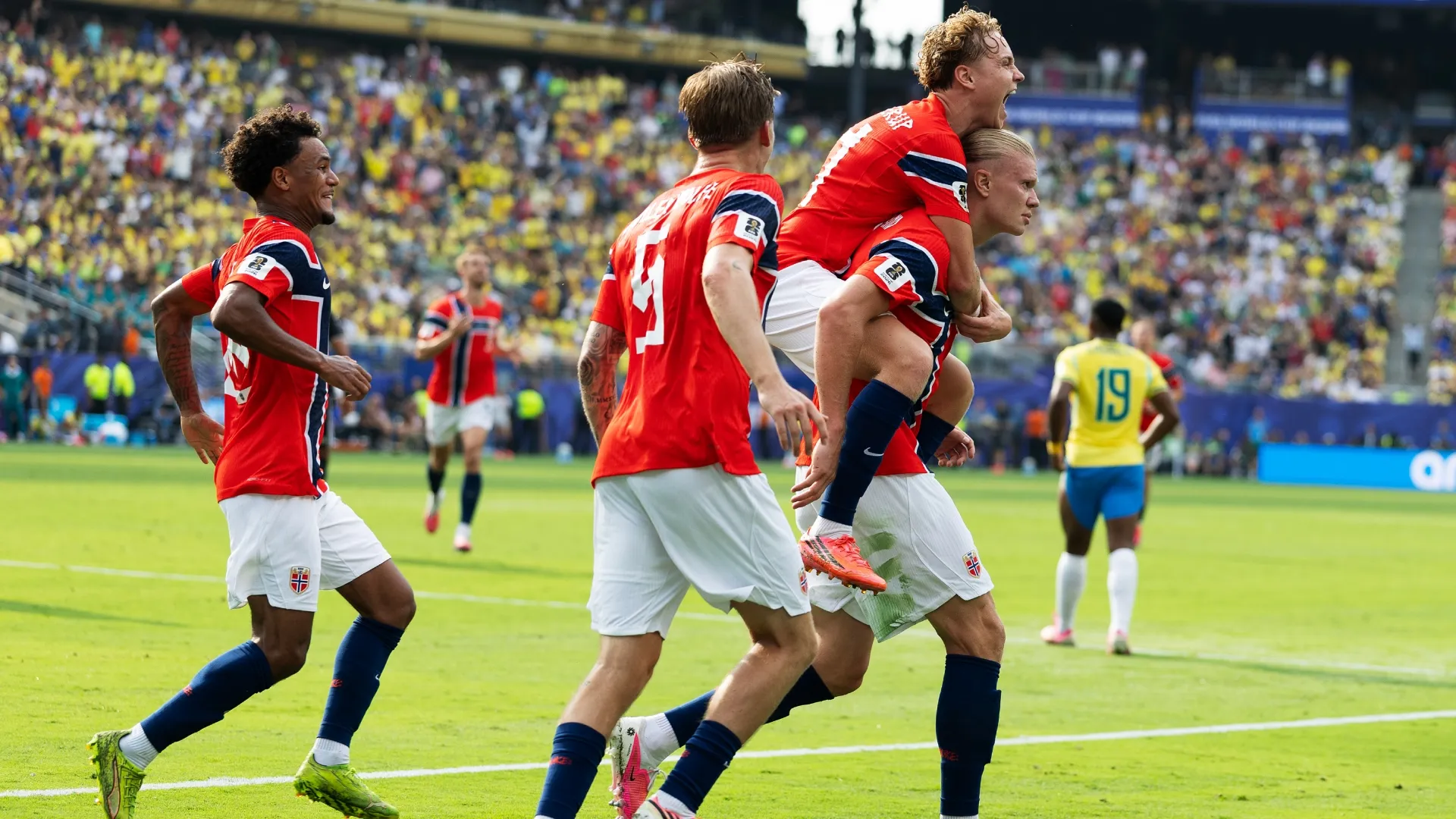 Erling Haaland #9 of Norway celebrates with teammates. Al Bello/Getty Images