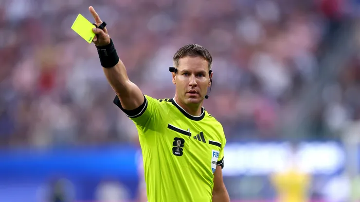 Referee Danny Makkelie holds a yellow card during the FIFA World Cup 2026 Group D match between USA and Paraguay at Los Angeles Stadium.