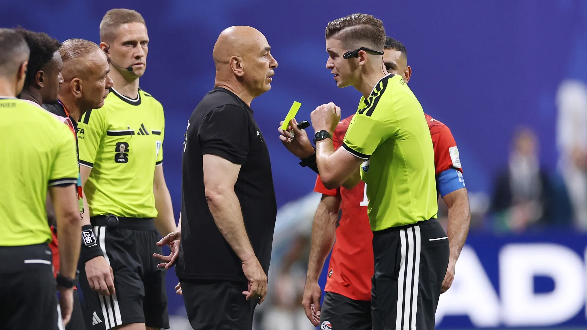 Referee Francois Letexier shows a yellow card to Hossam Hassan, Head Coach of Egypt. Buda Mendes/Getty Images