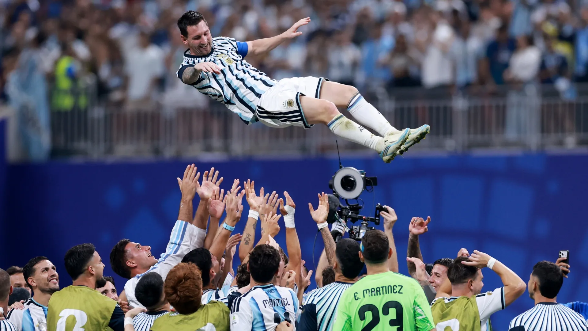 Lionel Messi celebrating with teammates.