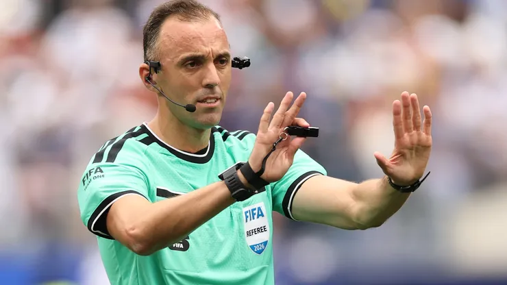 Referee Joao Pinheiro makes a decision.