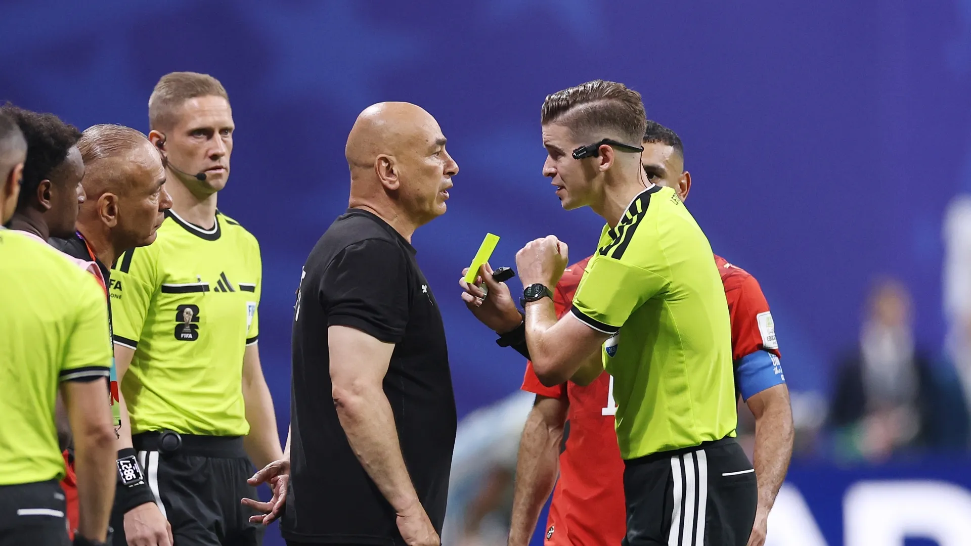 Head coach Hossam Hassan gets a yellow card by referee Francois Letexier
