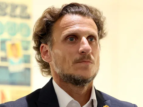 What is Diego Forlan's record managing a national team?