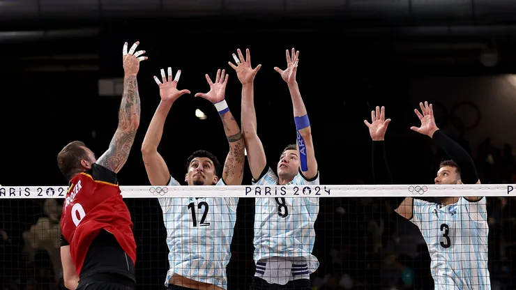 Bruno Lima #12, Agustin Loser #8 and Jan Martinez Franchi #3 of Team Argentina defend against a shot