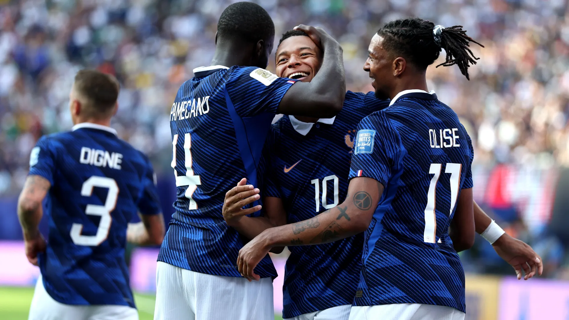 Kylian Mbappe #10 of France celebrates with teammates after scoring the team’s third goal. Al Bello/Getty Images