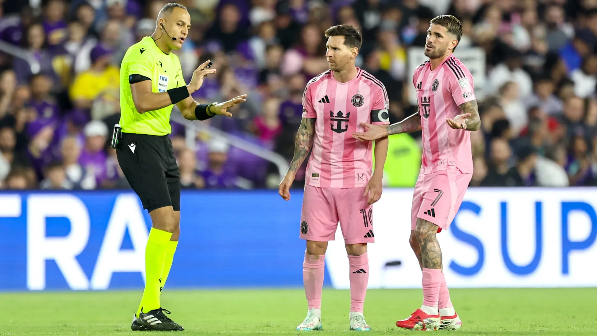 Rodrigo de Paul #7 and Lionel Messi #10 of Inter Miami talk with referee Ismail Elfath during an MLS match. Dustin Markland/Getty Images