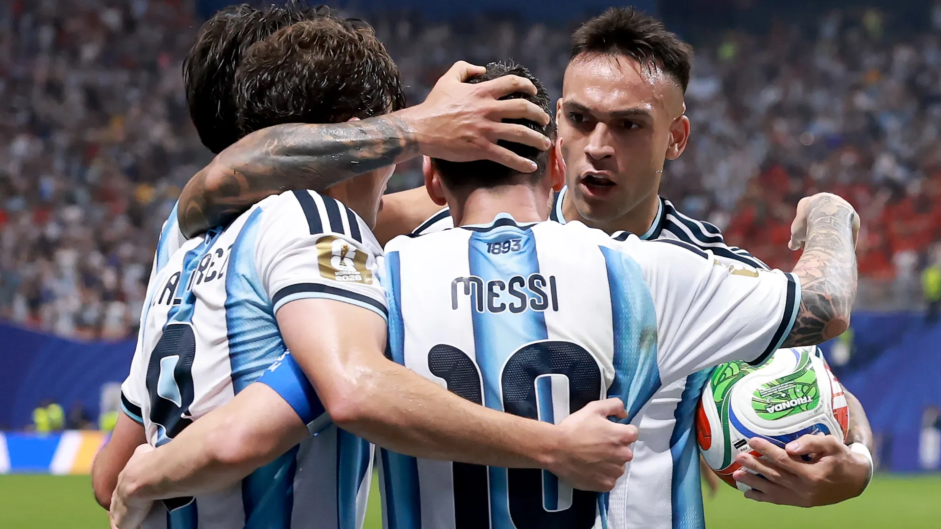 Lionel Messi #10 of Argentina celebrates with teammates. Elsa/Getty Images