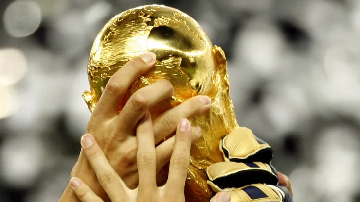 Players celebrate with the world cup trophy.